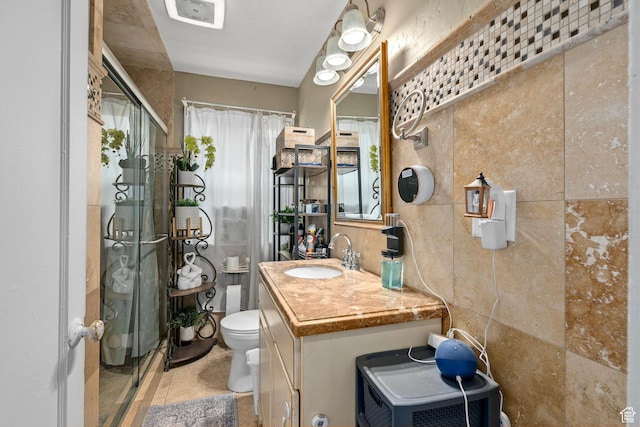 319 N 800 W, Orem, UT 84057 - bathroom with toilet, vanity, and a shower with door