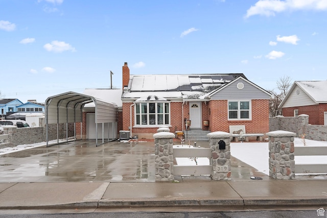 319 N 800 W, Orem, UT 84057 - bungalow-style home with brick siding, a carport, a fenced front yard, and central AC