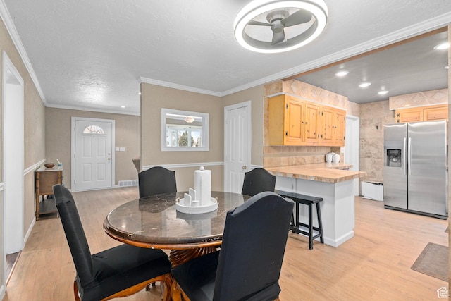 319 N 800 W, Orem, UT 84057 - dining area featuring a textured ceiling, ornamental molding, a ceiling fan, and light wood finished floors
