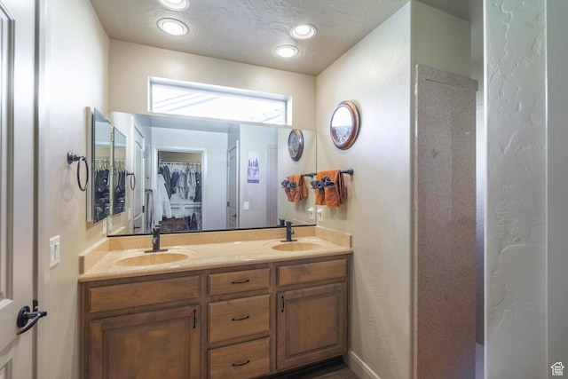 1369 W Country Club Dr, St George, UT 84790 - full bathroom featuring a spacious closet, double vanity, a sink, and recessed lighting