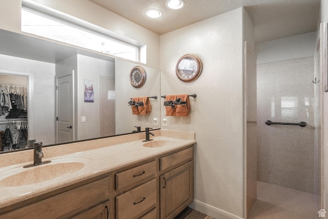 1369 W Country Club Dr, St George, UT 84790 - bathroom featuring double vanity, a sink, and a tile shower