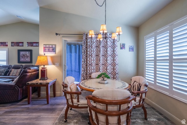 1369 W Country Club Dr, St George, UT 84790 - dining area with baseboards, a notable chandelier, wood finished floors, and lofted ceiling