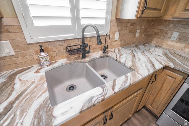 1369 W Country Club Dr, St George, UT 84790 - interior details featuring a sink, brown cabinetry, and light stone counters