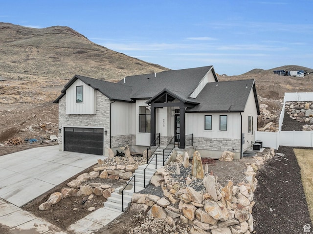 6579 W Bonnie Jean Ln Unit 12, Herriman, UT 84096 - modern inspired farmhouse with stone siding, a shingled roof, and fence