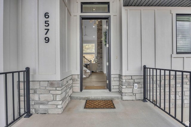 6579 W Bonnie Jean Ln Unit 12, Herriman, UT 84096 - doorway to property featuring stone siding and board and batten siding