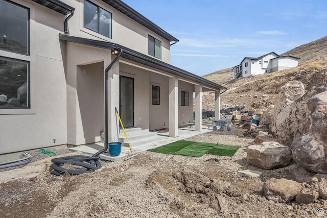 6579 W Bonnie Jean Ln Unit 12, Herriman, UT 84096 - exterior space with entry steps, stucco siding, and a patio