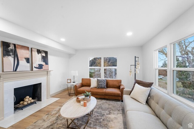 1585 S 2300 E, Salt Lake City, UT 84108 - living room with a tiled fireplace, wood finished floors, baseboards, and recessed lighting