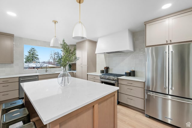1585 S 2300 E, Salt Lake City, UT 84108 - kitchen with a sink, premium range hood, light wood-type flooring, premium appliances, and backsplash