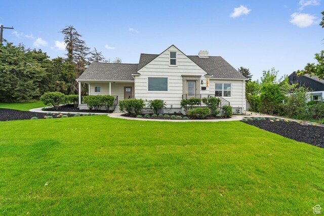 1585 S 2300 E, Salt Lake City, UT 84108 - bungalow-style house featuring roof with shingles, a chimney, and a front yard