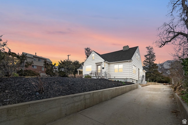 1585 S 2300 E, Salt Lake City, UT 84108 - exterior space with driveway, a chimney, and roof with shingles