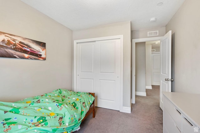 60 N 1100 W, Farmington, UT 84025 - bedroom featuring a closet, a textured ceiling, baseboards, light colored carpet, and visible vents