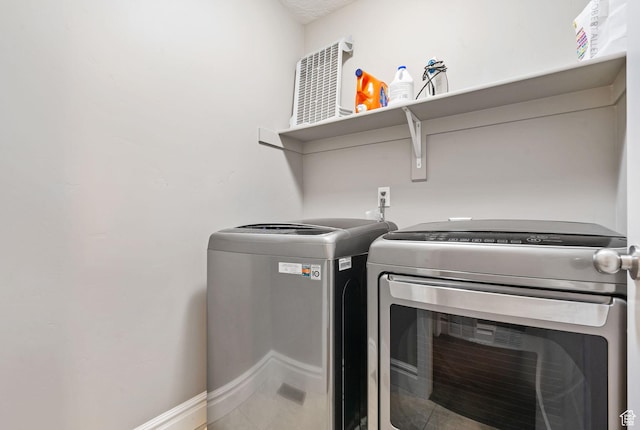 60 N 1100 W, Farmington, UT 84025 - clothes washing area with washer and clothes dryer, baseboards, and laundry area