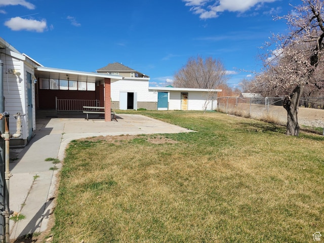 view of yard with a patio and fence