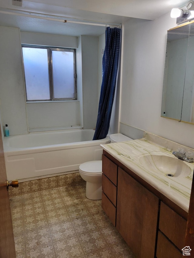 bathroom featuring visible vents, toilet, shower / bath combo with shower curtain, and vanity