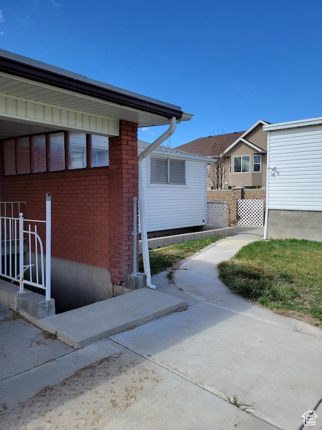 view of side of property with brick siding