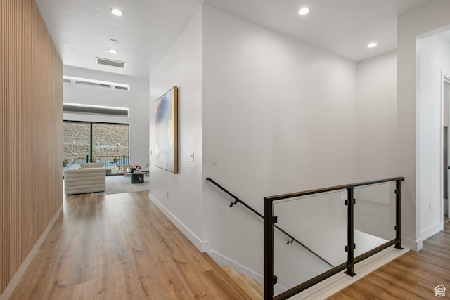 5516 N Valley View Rd, Lehi, UT 84043 - corridor with an upstairs landing, wood finished floors, baseboards, visible vents, and recessed lighting