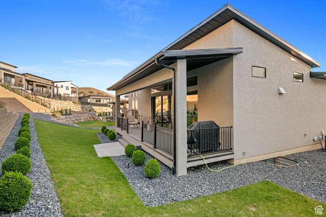 5516 N Valley View Rd, Lehi, UT 84043 - back of house featuring stucco siding, fence, and a lawn
