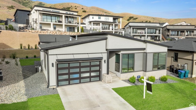 5516 N Valley View Rd, Lehi, UT 84043 - contemporary home featuring roof with shingles, an attached garage, driveway, a mountain view, and central AC