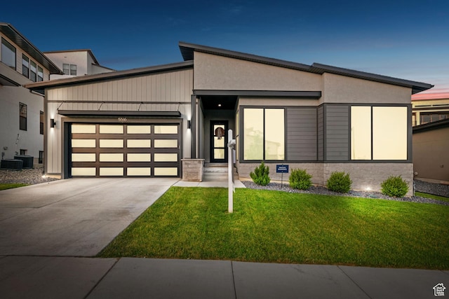 5516 N Valley View Rd, Lehi, UT 84043 - contemporary home with driveway, a garage, stone siding, and a front yard