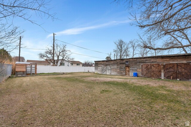 13496 S Redwood Rd, Riverton, UT 84065 - view of yard with fence, an outdoor structure, and a barn