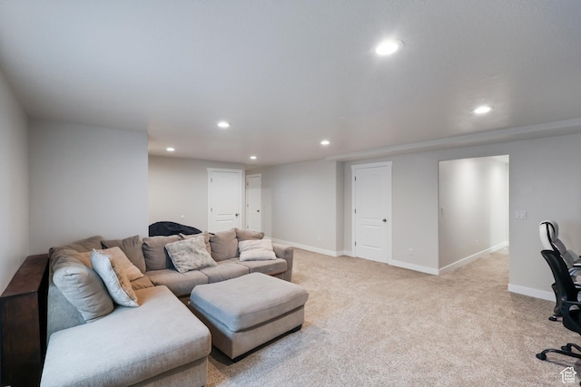 living area featuring light colored carpet, baseboards, and recessed lighting