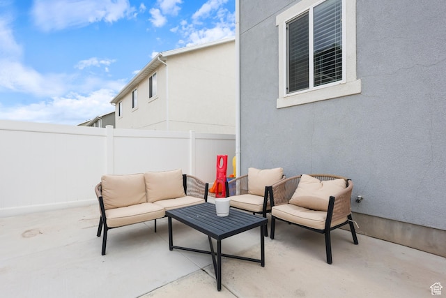 view of patio / terrace featuring outdoor lounge area and fence