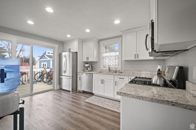 214 W 600 S, Heber City, UT 84032 - kitchen with white cabinetry, wood finished floors, and appliances with stainless steel finishes