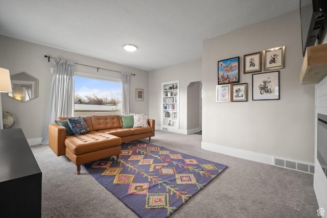 214 W 600 S, Heber City, UT 84032 - living room featuring baseboards, carpet flooring, a fireplace, and visible vents