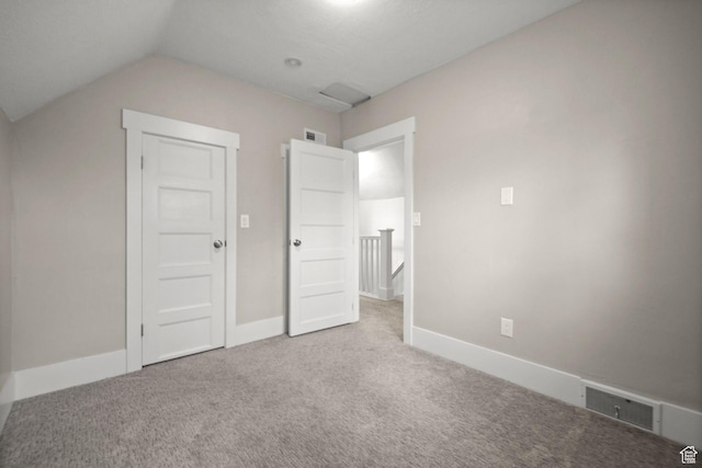 214 W 600 S, Heber City, UT 84032 - unfurnished bedroom featuring baseboards, visible vents, lofted ceiling, and carpet