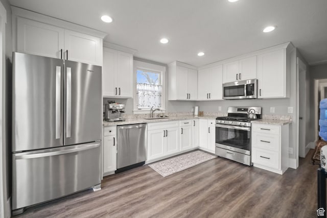 214 W 600 S, Heber City, UT 84032 - kitchen with white cabinets, a sink, appliances with stainless steel finishes, and dark wood-type flooring