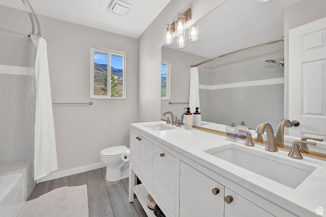 4216 N Wolf Creek Dr, Eden, UT 84310 - full bathroom featuring a sink, toilet, shower / tub combo, and wood finished floors