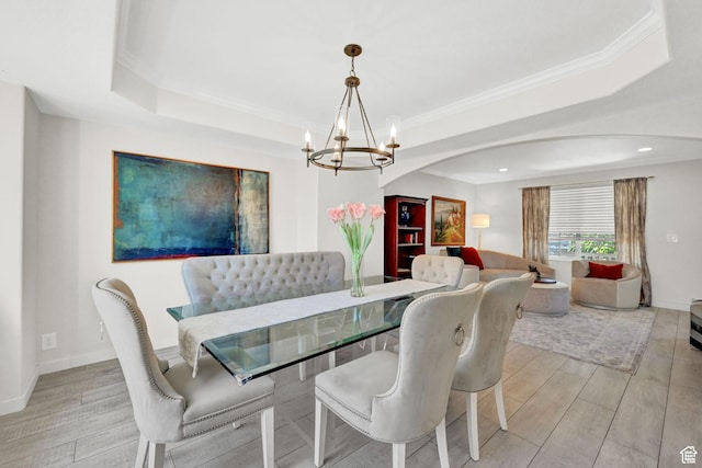 4216 N Wolf Creek Dr, Eden, UT 84310 - dining room with baseboards, a notable chandelier, light wood-type flooring, and a raised ceiling