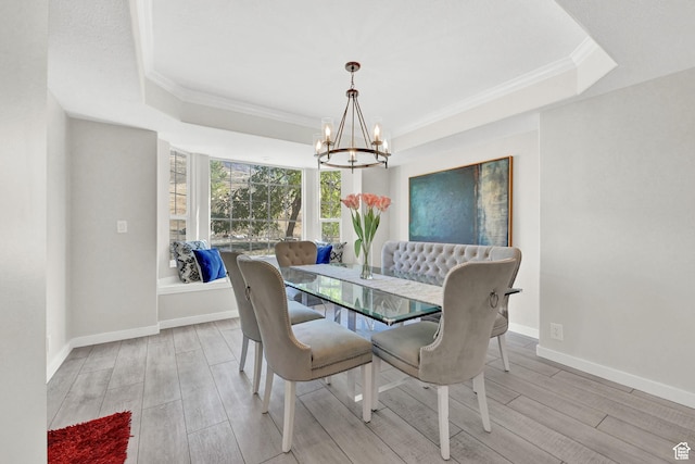 4216 N Wolf Creek Dr, Eden, UT 84310 - dining room with crown molding, baseboards, wood finished floors, a raised ceiling, and a notable chandelier