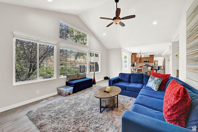 4216 N Wolf Creek Dr, Eden, UT 84310 - living room featuring a wealth of natural light, visible vents, wood finished floors, and baseboards