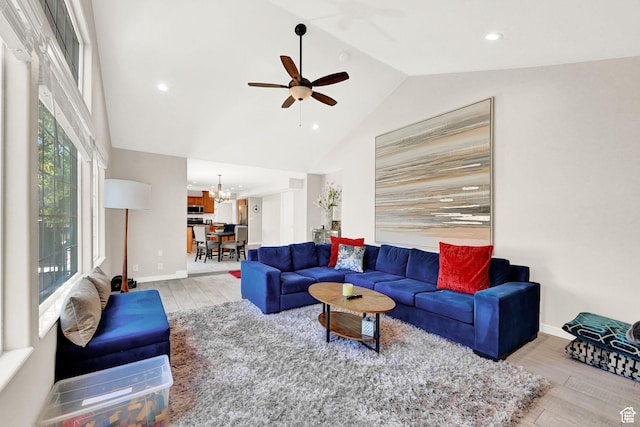 4216 N Wolf Creek Dr, Eden, UT 84310 - living area with vaulted ceiling, recessed lighting, ceiling fan with notable chandelier, baseboards, and light wood-style floors