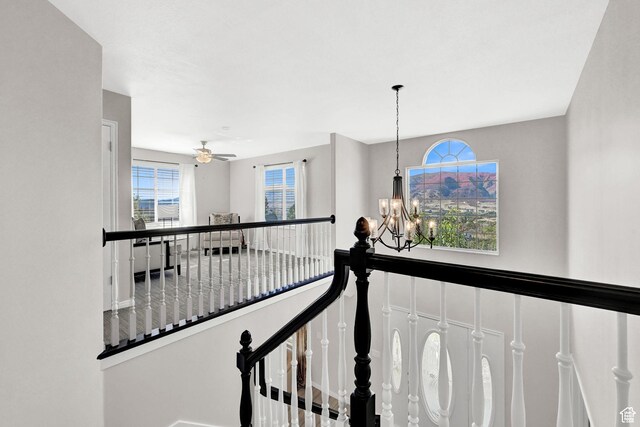 4216 N Wolf Creek Dr, Eden, UT 84310 - hall featuring an upstairs landing and a notable chandelier