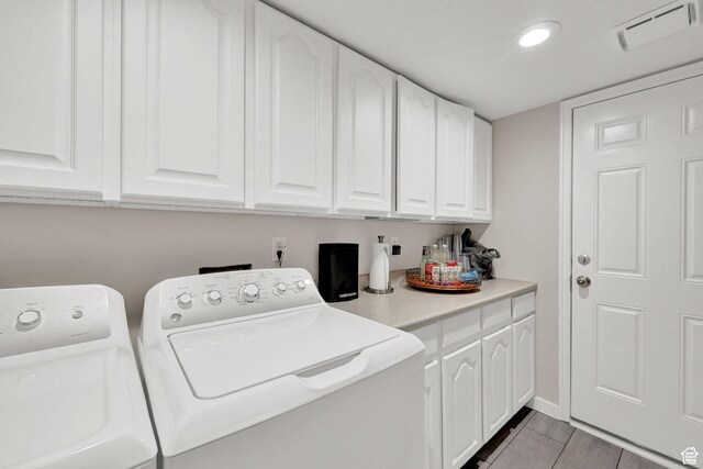 4216 N Wolf Creek Dr, Eden, UT 84310 - washroom featuring light tile patterned floors, cabinet space, washer and dryer, and visible vents