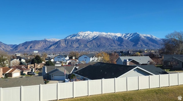 view of mountain backdrop featuring nearby suburban area