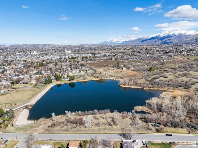 aerial view featuring a water and mountain view