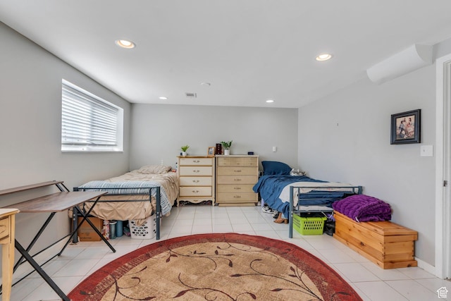 bedroom with recessed lighting and light tile patterned floors