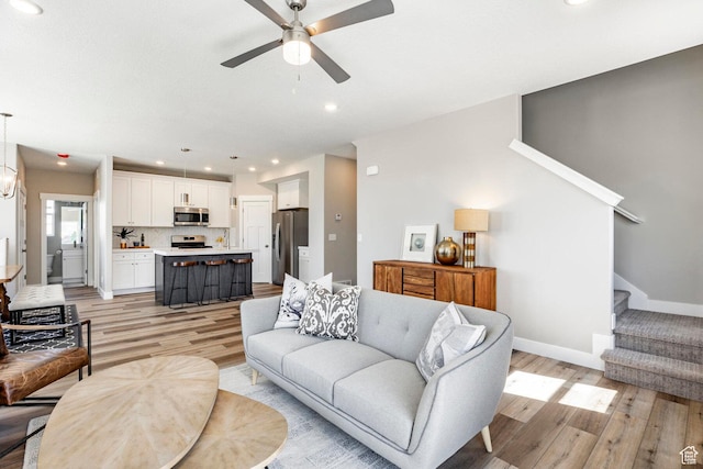 2748 E 1060 S, Spanish Fork, UT 84660 - living area featuring stairs, recessed lighting, light wood-type flooring, baseboards, and a ceiling fan