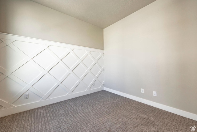 2748 E 1060 S, Spanish Fork, UT 84660 - empty room featuring baseboards, dark colored carpet, and a textured ceiling