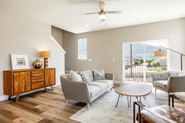 2748 E 1060 S, Spanish Fork, UT 84660 - living area featuring a wealth of natural light, light wood-style floors, ceiling fan, and baseboards