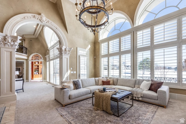 2726 E Wasatch Dr Unit 18, Salt Lake City, UT 84108 - living room featuring decorative columns, a wealth of natural light, and carpet