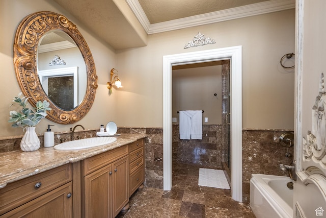 2726 E Wasatch Dr Unit 18, Salt Lake City, UT 84108 - bathroom featuring tile walls, a bathing tub, vanity, wainscoting, and ornamental molding