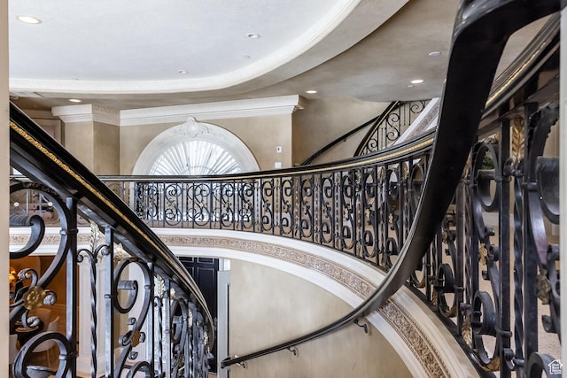 2726 E Wasatch Dr Unit 18, Salt Lake City, UT 84108 - staircase with a towering ceiling, recessed lighting, and crown molding