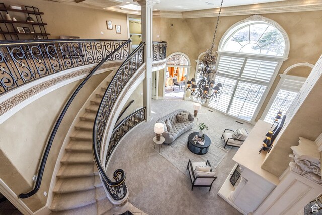 2726 E Wasatch Dr Unit 18, Salt Lake City, UT 84108 - stairs featuring decorative columns, carpet floors, ornamental molding, and a high ceiling