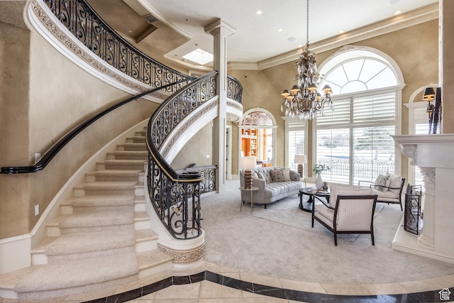 2726 E Wasatch Dr Unit 18, Salt Lake City, UT 84108 - stairway with recessed lighting, decorative columns, ornamental molding, a high ceiling, and a fireplace