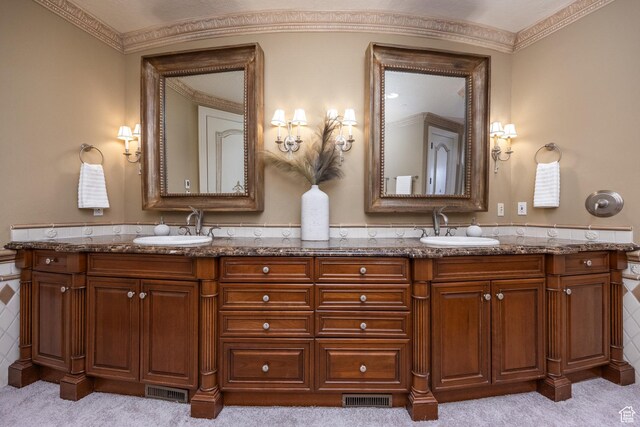 2726 E Wasatch Dr Unit 18, Salt Lake City, UT 84108 - bathroom featuring double vanity, visible vents, and a sink
