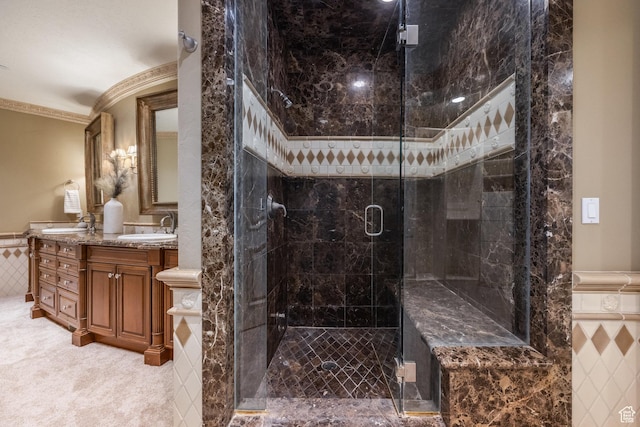 2726 E Wasatch Dr Unit 18, Salt Lake City, UT 84108 - bathroom featuring double vanity, ornamental molding, a sink, a stall shower, and wainscoting